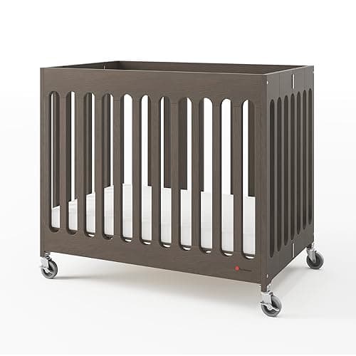 Foundations Boutique Compact Folding Crib, Modern, Contemporary, Mini Crib for Guest Rooms, Vacation Homes, and Small Nurseries, Available in 5 Finishes, Mattress Included (Gray)