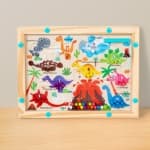 Dinosaur-themed wooden children's magnetic bead maze color sorting and counting board - an early education toy for babies.